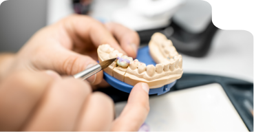 Dental lab technician creating a denture